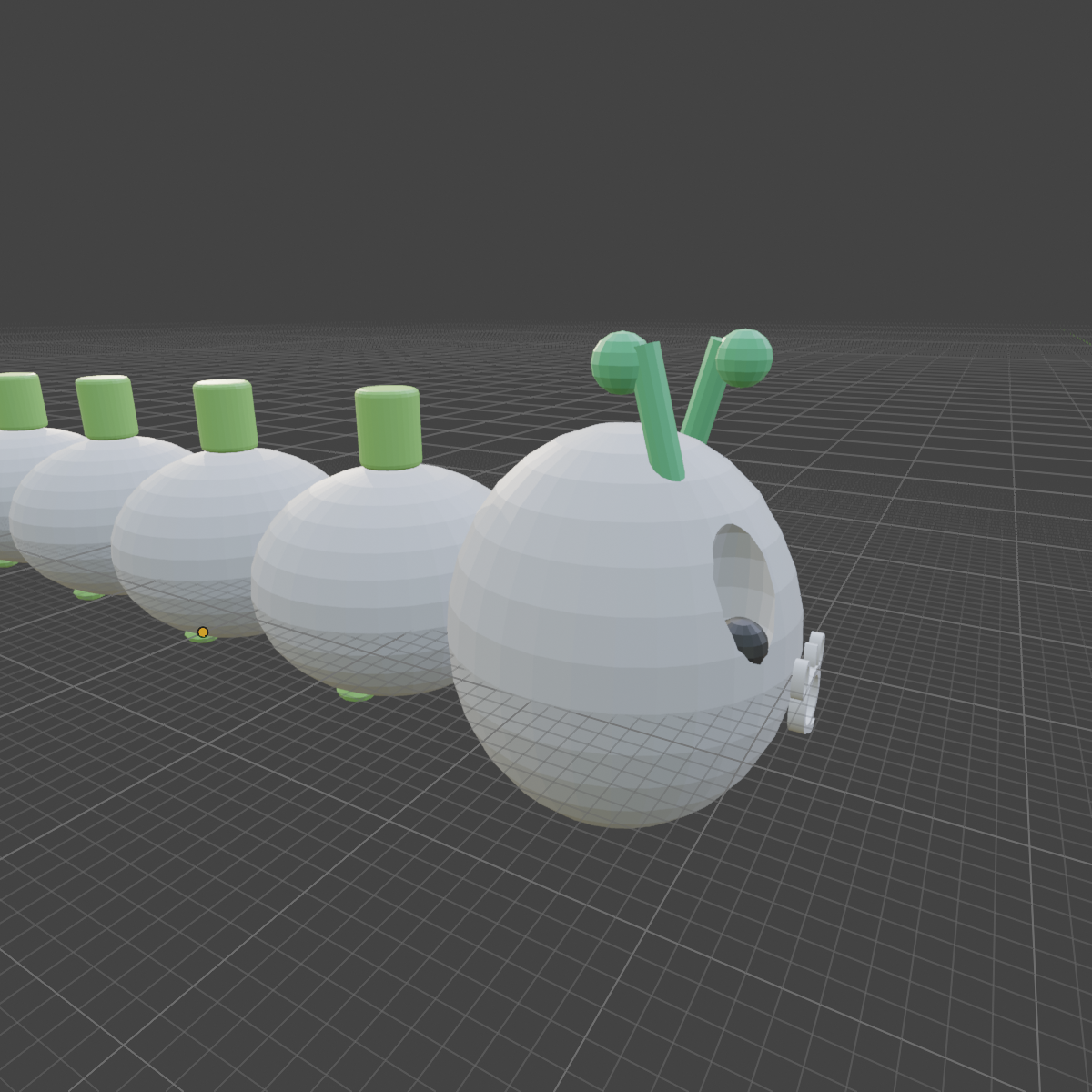 Detail of the head with eyes, antennae, and Q monogram